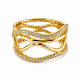 Gold ring with interwoven design and embedded stones on a white background