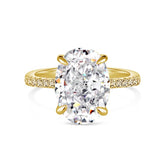 An 18k gold solitaire ring with a large oval stone and small diamonds around the band